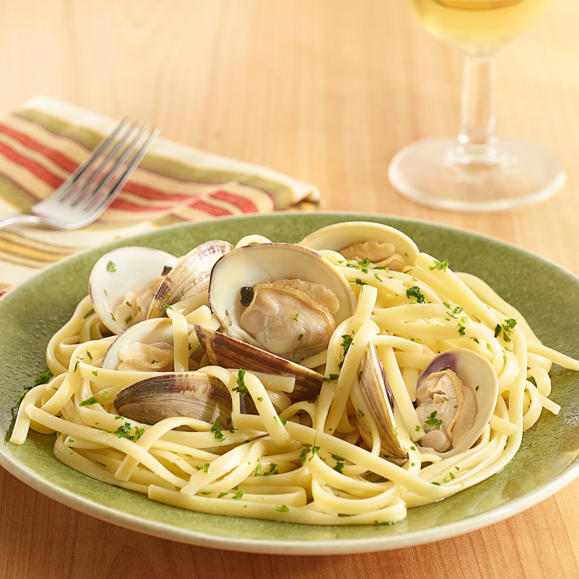 Garlic Steamed Clams And Linguini Recipe from HEB