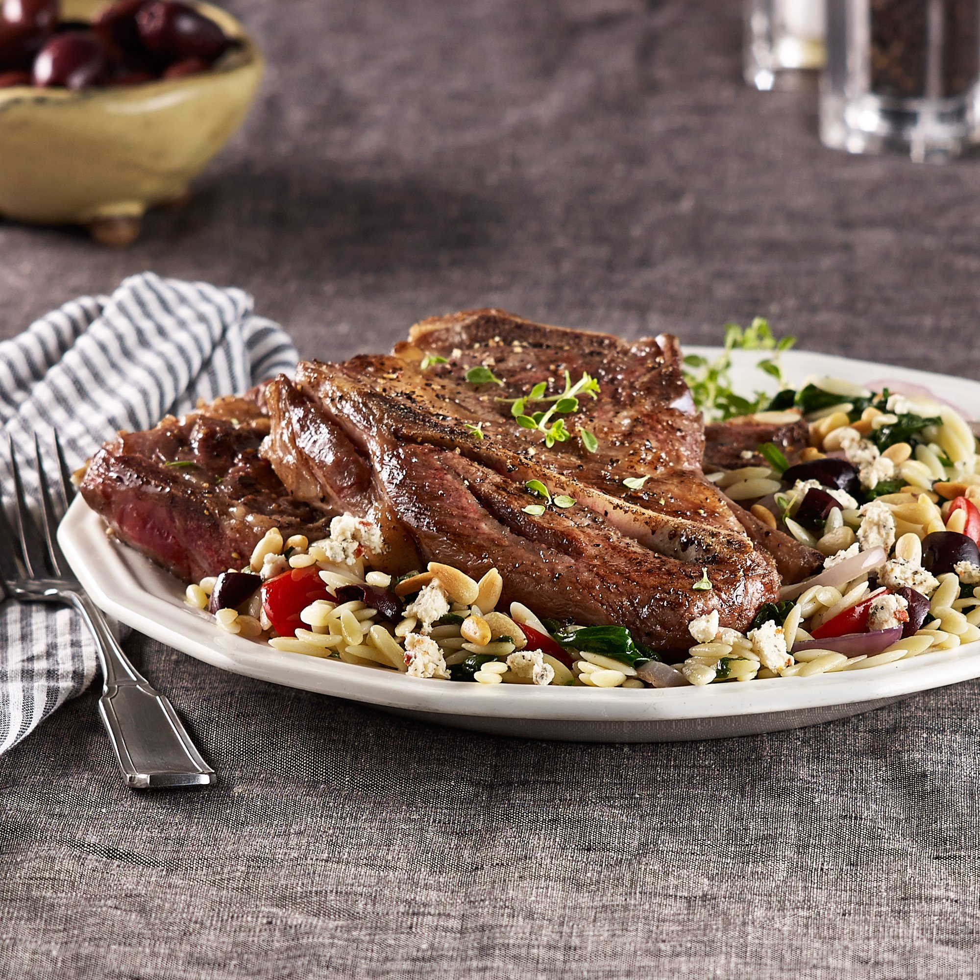 Lamb Chops With Herbed Orzo And Spinach Recipe from HEB