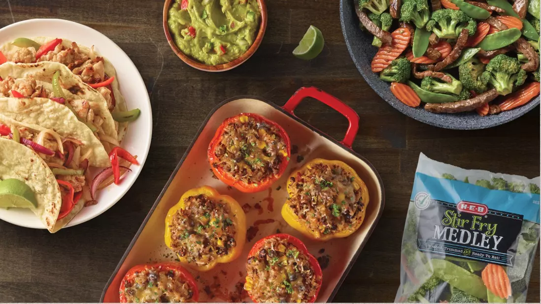 Tacos with a side of guacamole, beef stuffed peppers, and beef stir fry