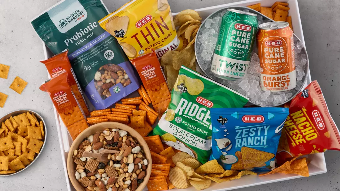 Chips, pure cane soda (twist), pure cane soda (orange), higher harvest trail mix