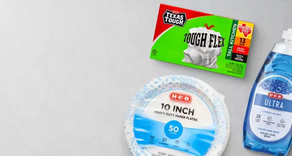 Banner promoting everyday household essentials featuring Texas Tough Flex trash bags, H‑E‑B 10-inch paper plates, and Ultra dish soap. Text reads: “One stop shop for daily essentials.”