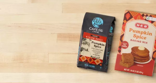 Banner featuring a bag of Café Olé Pumpkin Spice coffee and H‑E‑B Pumpkin Spice Baking Mix on a wooden surface. Text reads: “Fall finds you'll love.”