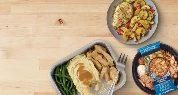 Banner featuring a Meal Simple turkey dinner with sliced turkey, mashed potatoes with gravy, and green beans in a meal tray. A packaged Meal Simple entrée and roasted vegetables are shown alongside. Text reads: “Meal Simple for busy nights.”