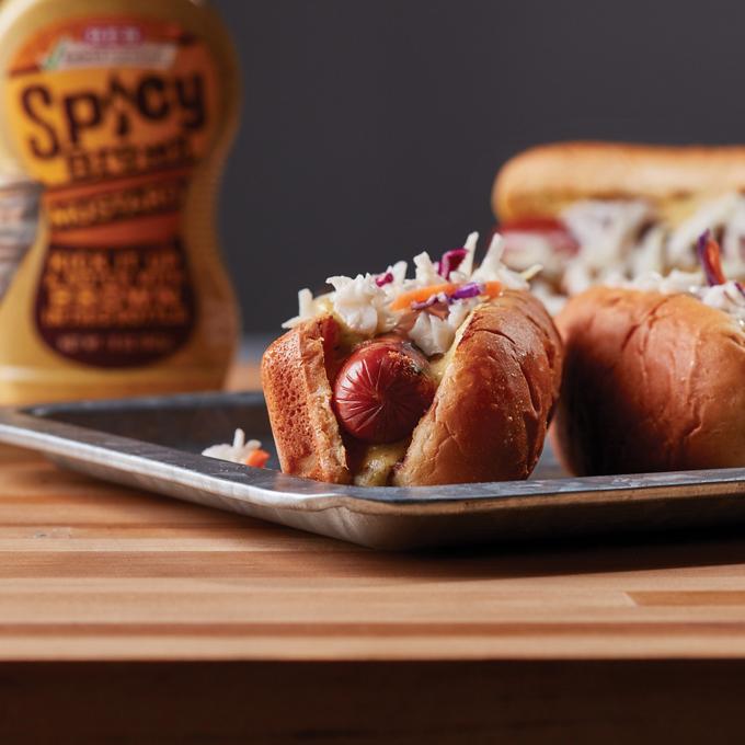Premium Photo | A hot dog with mustard and tomato sauce on it Premium Photo | A hot dog with mustard and tomato sauce on it