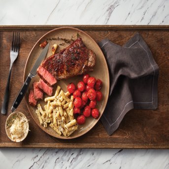Pan Seared Steaks with Truffle Mac and Blistered Tomatoes