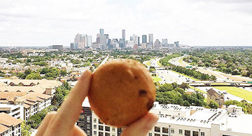 Bagel Dot Amongst the City Skyline