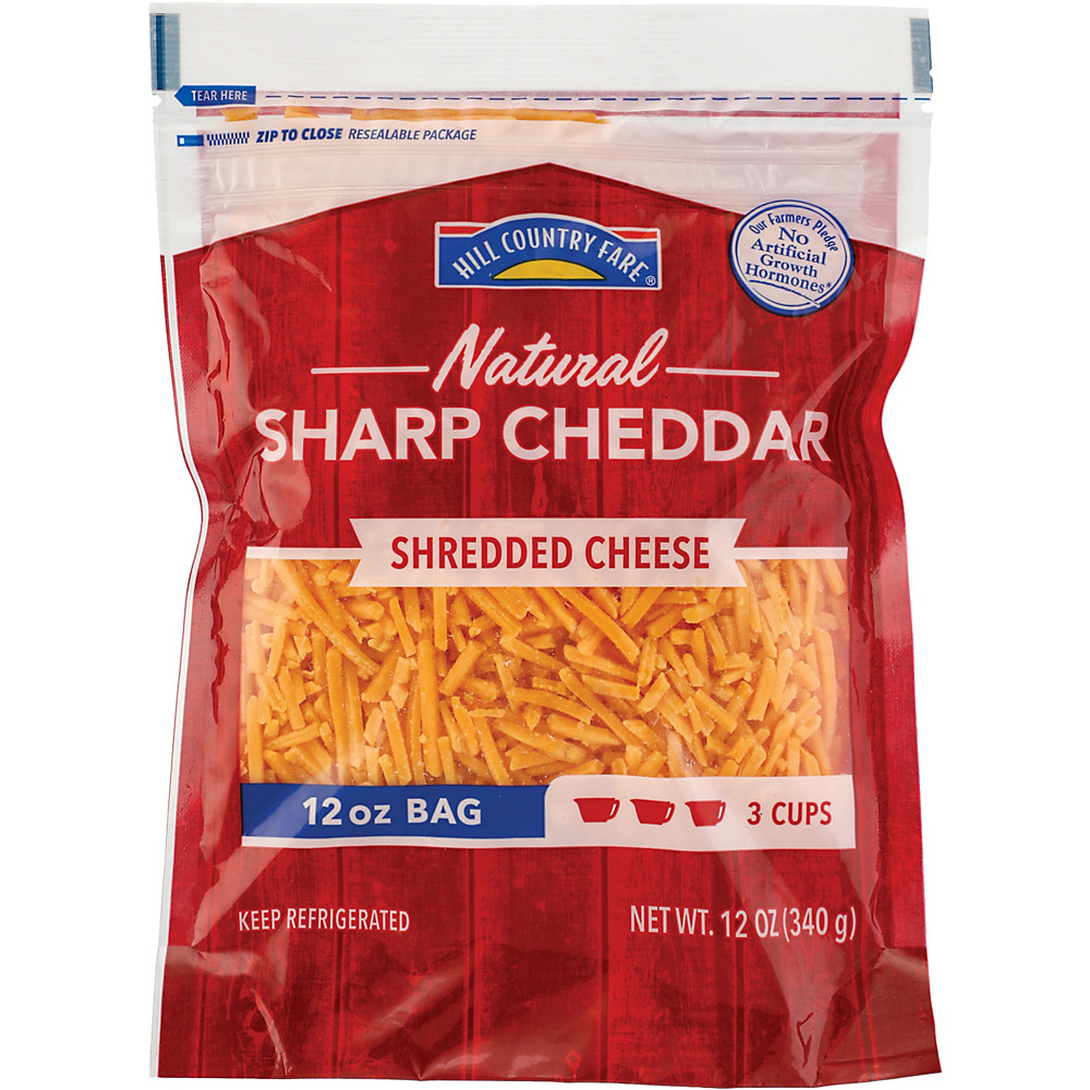Calories in Hill Country Fare Shredded Sharp Cheddar Cheese, 12 oz