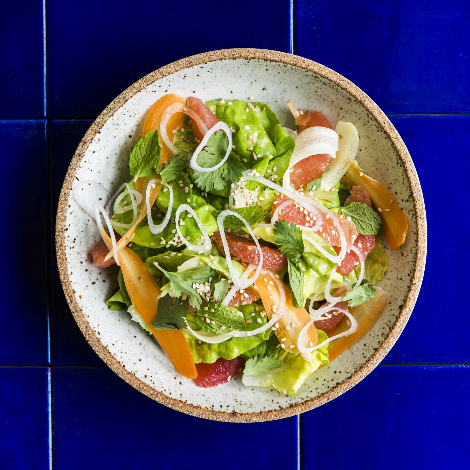 https://images.heb.com/is/image/HEBGrocery/recipe-hm-large/salad-with-grapefruit-carrots-and-fish-sauce-vinaigrette-recipe.jpg